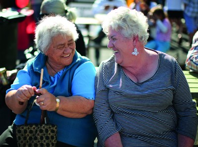 Two women laughing together